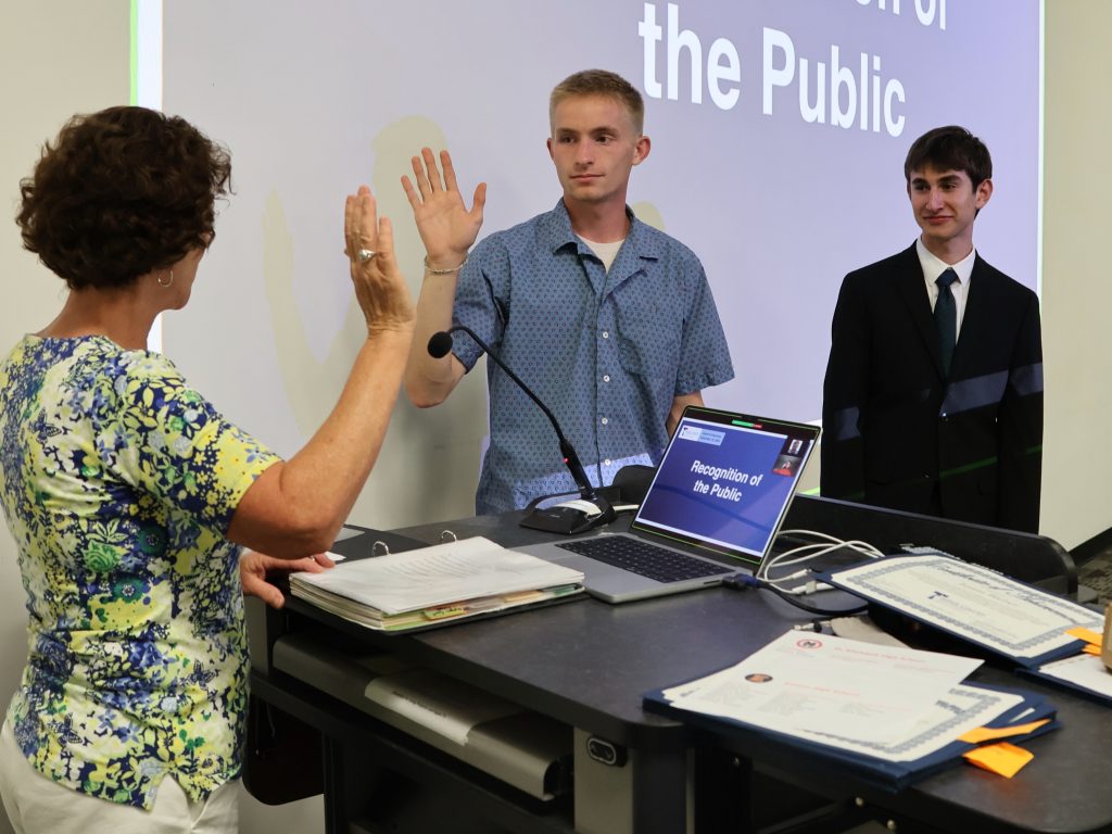 Colin Smith (EHS, left) and Nathan Henckel (SMMHS, right) were sworn in to represent their schools as Student Board of Education Members at the September Meeting.